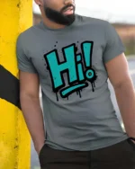 Vibrant Teal Spray Paint Hi Typography Slogan Graphic Tee - model wearing grey tee, leaning on column