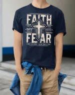 Inspiring Faith Over Fear Psalm Bible Verse Graphic Tee - model wearing navy tee with hands in pockets