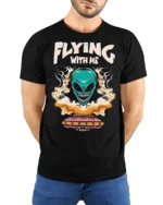 Thrilling Flying With Me Teal Alien Spaceship Tshirt - model wearing black tee with hands behind back