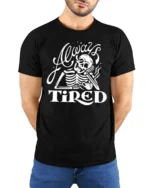 Sarcastic Always Tired Skeleton Drinking Coffee Graphic Tee - model wearing black tee with hands behind back