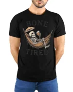 Sarcastic Bone Tired Sleeping Skeleton Hammock Graphic Tee - model wearing black tee with hands behind back