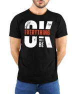 Motivating OK Everything Will Be OK Text Graphic Tshirt - model wearing black tee with hands behind back