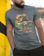 Powerful Lavlay Profit Pitbull Chomp Money Graphic Tee - model wearing grey tee, leaning on column