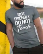 Sarcastic Not Friendly Do Not Touch Moody Slogan Tshirt - model wearing grey tee, leaning on column