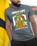 Dynamic High Up Alien Surpass Your Limit Sci Fi Graphic Tee - model wearing grey tee, leaning on column
