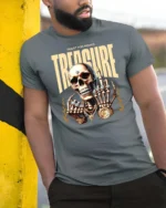 Quest For Riches Golden Skull Luxury Bling Graphic Tee - model wearing grey tee, leaning on column