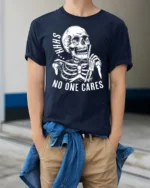 Sarcastic Shhh No One Cares Silent Skull Graphic Tshirt - model wearing navy tee with hands in pockets