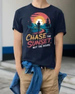 Inspiring Chase The Sunset Outdoor Nature Graphic Tee - model wearing navy tee with hands in pockets