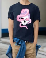 Alluring Pastel Sugar Skull Pink Serpent Graphic Tee - model wearing navy tee with hands in pockets