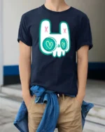 Charming Pastel Goth Bunny Skull Heart Eyes Graphic Tee - model wearing navy tee with hands in pockets
