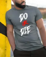Aggressive Do Or Die Hardcore Workout Motivation Graphic Tee - model wearing grey tee, leaning on column