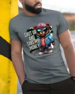 Sarcastic Shut Up And Take My Money Teddy Bear Graphic Tee - model wearing grey tee, leaning on column