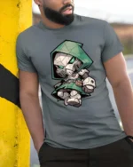 Chibi Doctor Doom Mask Green Hooded Armor Graphic Tee - model wearing grey tee, leaning on column
