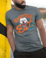 Aggressive Hungry Dogs Eat White Pitbull Splatter Graphic Tee - model wearing grey tee, leaning on column