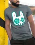 Charming Pastel Goth Bunny Skull Heart Eyes Graphic Tee - model wearing grey tee, leaning on column