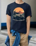 Off Road Jeep Adventure Mountain Sunset Outdoor Graphic T Shirt - model wearing navy tee with hands in pockets